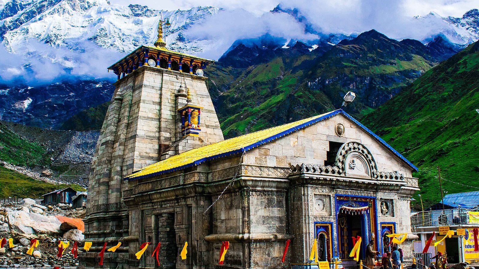 Ancient Kedarnath Temple against snow-covered Himalayan peaks, Uttarakhand – Delhi to Kedarnath Urbania on rent for family & group tours